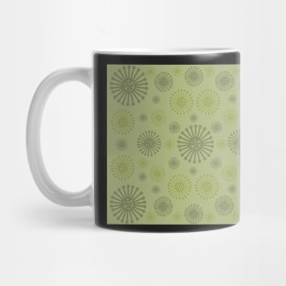 Gently on the Green. A tranquil design featuring wagon wheels in soft olive and mossy green tones. Mug